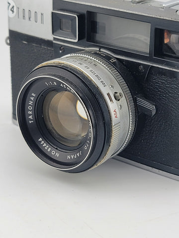 Vintage 1970's Taron Auto EE 35mm Film Camera F1.8 45mm lens. Untested.