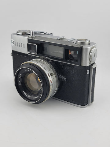 Vintage 1970's Taron Auto EE 35mm Film Camera F1.8 45mm lens. Untested.