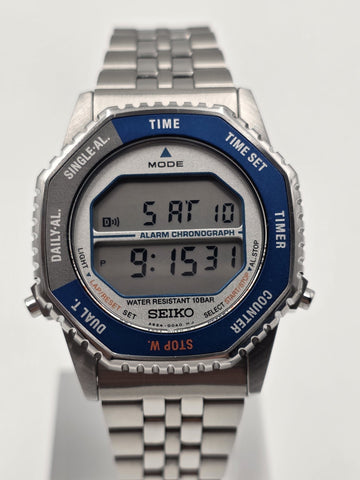 Seiko SMGG21P1 A824 Digital Alarm Chronograph Blue Bezel Watch Box Papers