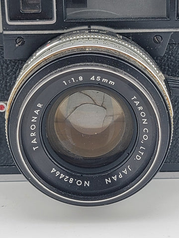 Vintage 1970's Taron Auto EE 35mm Film Camera F1.8 45mm lens. Untested.