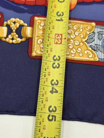 Hermès Silk Scarf 90 “Tibet” Cathy Latham Blue Red Gold Tibetan Jewelry Motif