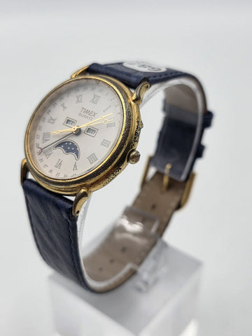 VTG TIMEX TRIPLE DATE MOON PHASE DIAL QUARTZ GOLDEN BLACK DRESS WATCH. WORKING