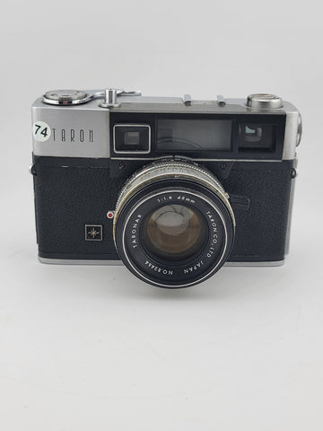 Vintage 1970's Taron Auto EE 35mm Film Camera F1.8 45mm lens. Untested.
