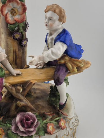 ANTIQUE 19th C DRESDEN VON SCHIERHOLZ BOY & GIRL ON SEESAW FIGURINE. 10.5 in.