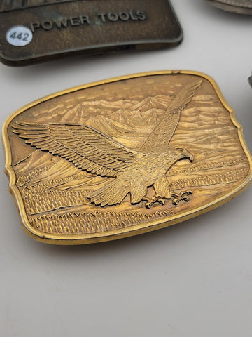 Lot Of 4 Vintage Collectible Belt Buckles. Remington, J. Deer, Makita, Eagle.