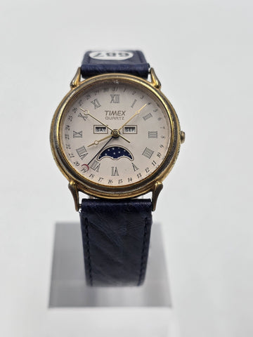 VTG TIMEX TRIPLE DATE MOON PHASE DIAL QUARTZ GOLDEN BLACK DRESS WATCH. WORKING