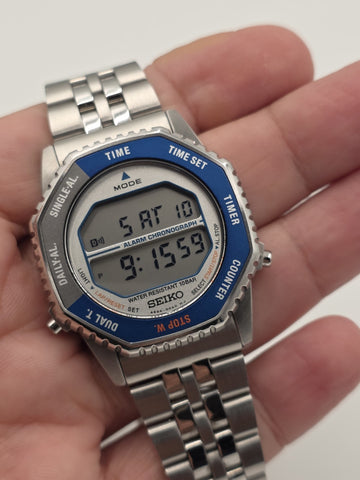 Seiko SMGG21P1 A824 Digital Alarm Chronograph Blue Bezel Watch Box Papers