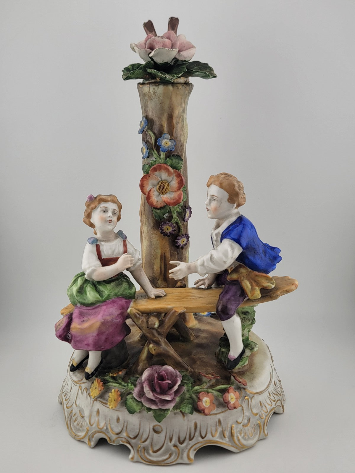 ANTIQUE 19th C DRESDEN VON SCHIERHOLZ BOY & GIRL ON SEESAW FIGURINE. 10.5 in.
