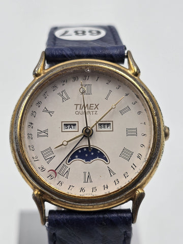 VTG TIMEX TRIPLE DATE MOON PHASE DIAL QUARTZ GOLDEN BLACK DRESS WATCH. WORKING